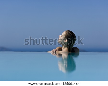 Profile of woman in pool with eyes closed