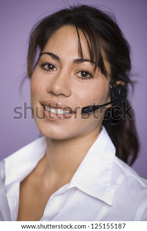 Portrait of a young woman with headset