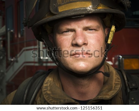 Close-up of a young firefighter wearing hard hat