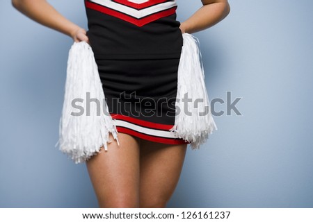 Mid section of female cheerleader