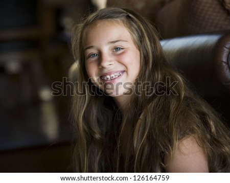 Portrait of young girl smiling with dental braces