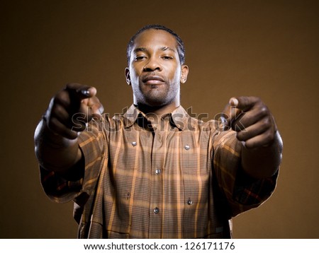 Portrait of African American man pointing