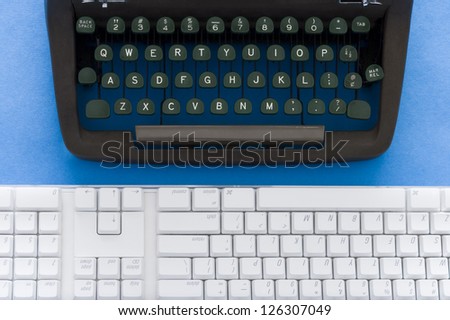 Old typewriter and modern keyboard