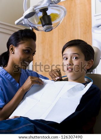 Scared boy at dentist cabinet