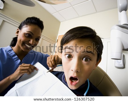Shocked boy at dentist cabinet