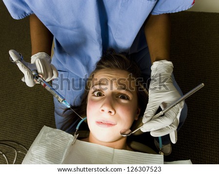 Portrait of scared girl in dentist cabinet