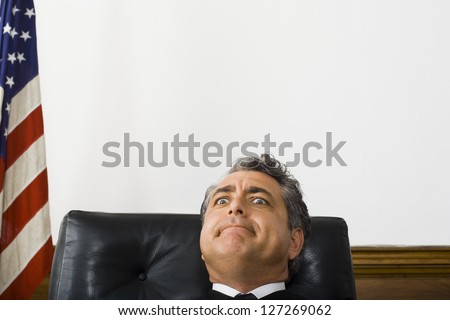 A male judge making a face
