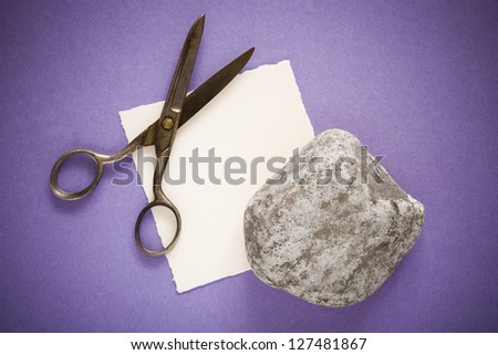 Rock, paper and scissors over purple background