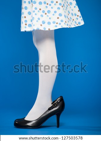 Low section of a girl in high heeled shoes