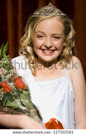 Portrait of a beauty pageant winner excited