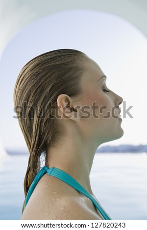 Profile of woman in bathing suit with wet hair