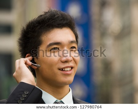 Man with a cell phone earpiece.