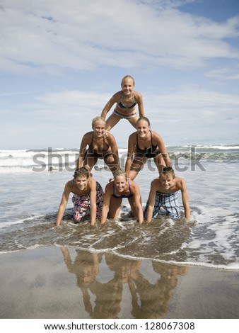 Human pyramid on the beach.