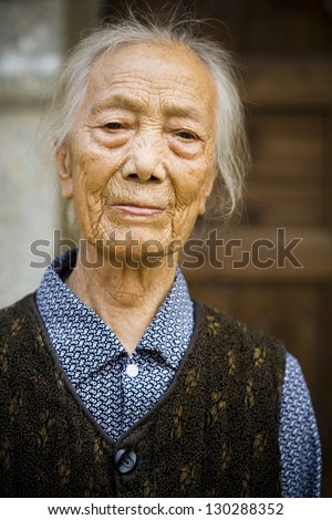 portrait of elderly Chinese woman outdoors