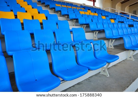 Empty bright blue stadium seats