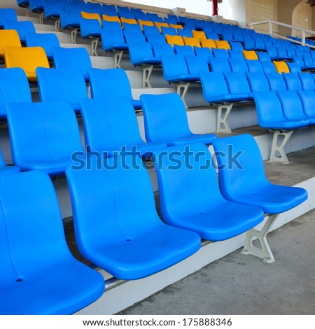 Empty bright blue stadium seats