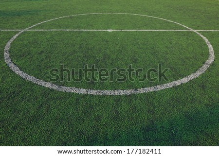 Artificial soccer field stadium on the green grass, sport game background for design