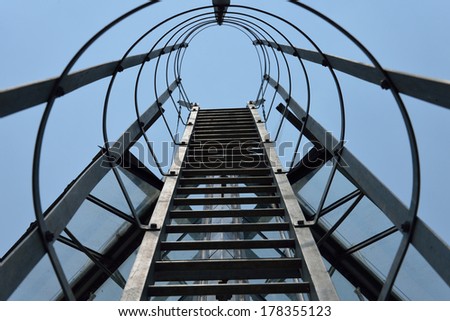 Fire escape ladder on a building office, iron staircase, abstract point peak of business