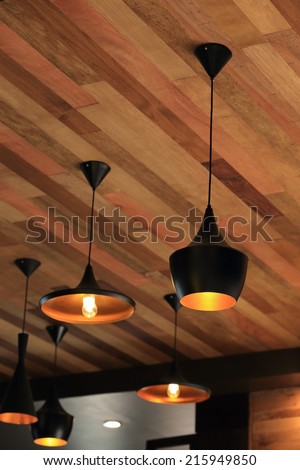 black pendant lamp on ceiling wood wall