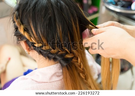 long braid creative brown hair style in salon beauty