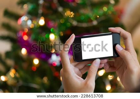 hand using mobile smart phone with colorful light celebration background