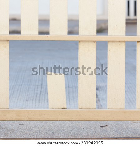 white wood fence of broken damaged