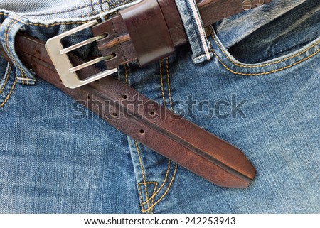 blue jeans with brown leather belt