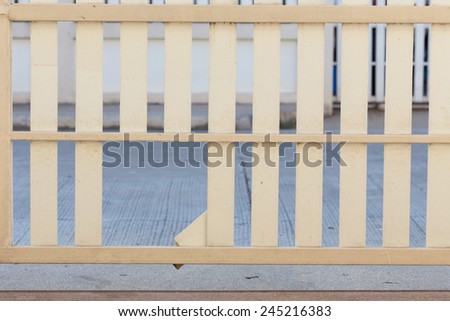 white wood fence of broken damaged