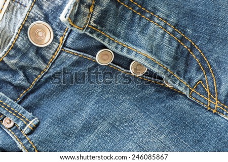 metal botton on fashion blue jeans