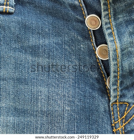 metal button on fashion blue jeans