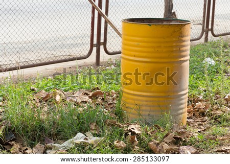 yellow trashcan of recycle old fuel tank