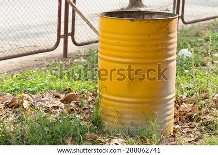 yellow trashcan of recycle old fuel tank