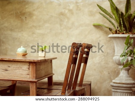 set of wooden table and chair decorated in garden, interior of cafe coffee shop with natural