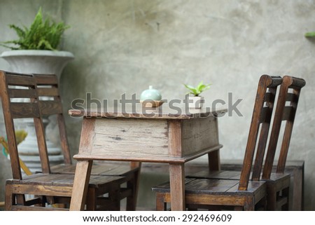 set of wooden table and chair decorated in garden, interior of cafe coffee shop with natural