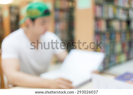 library blur background with student and bookshelf