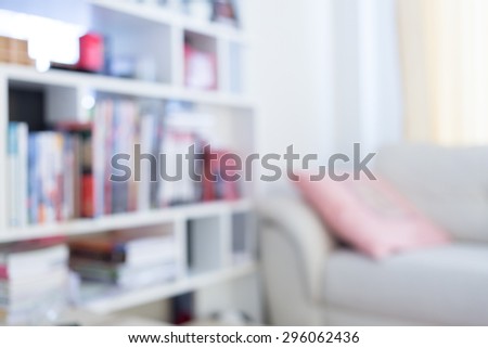 blur image background, book shelf and sofa furniture interior decoration in home