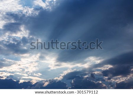 light of sunbeam on blue sky background with clouds and sun light
