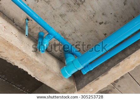 water pipes pvc plumbing under cement ceiling of second floor in construction site building