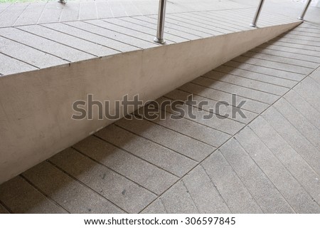 ramp way for support wheelchair disabled people made from sand and small gravel stone washed floor