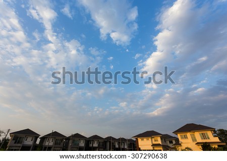 beautiful blue sky and clouds with residential house of village, property real estate industry background
