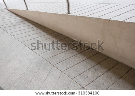 ramp way for support wheelchair disabled people made from sand and small gravel stone washed floor