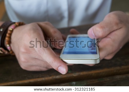 businessman using a mobile phone with texting message on app smartphone, playing internet on mobile