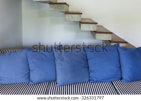 interior living room modern style with blue sofa furniture and staircase in white room