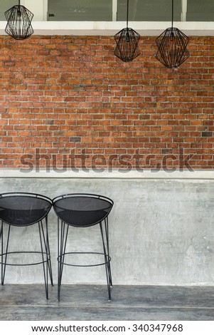 cement counter nightclub with seat bar stool and brick wall background