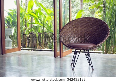 interior design, sofa furniture contemporary style in living room with natural garden outside the window