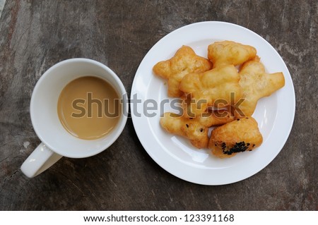 Deep fried dough stick and coffee