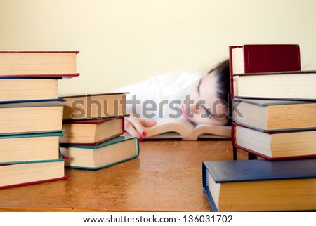 Woman sleeping after a hard study session