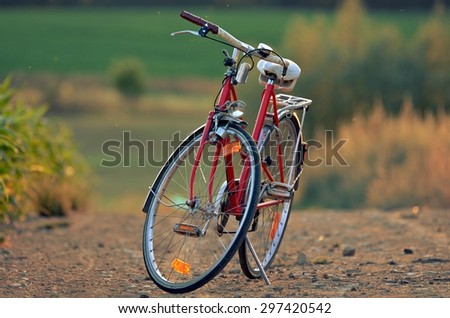 Old red bicycle with retro effect