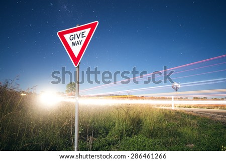Road sign with stars in the background in the outback of Queensland, Australia. High Noise.