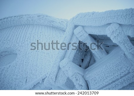Snow covered frozen building in the mountains. Church in the winter mountains.